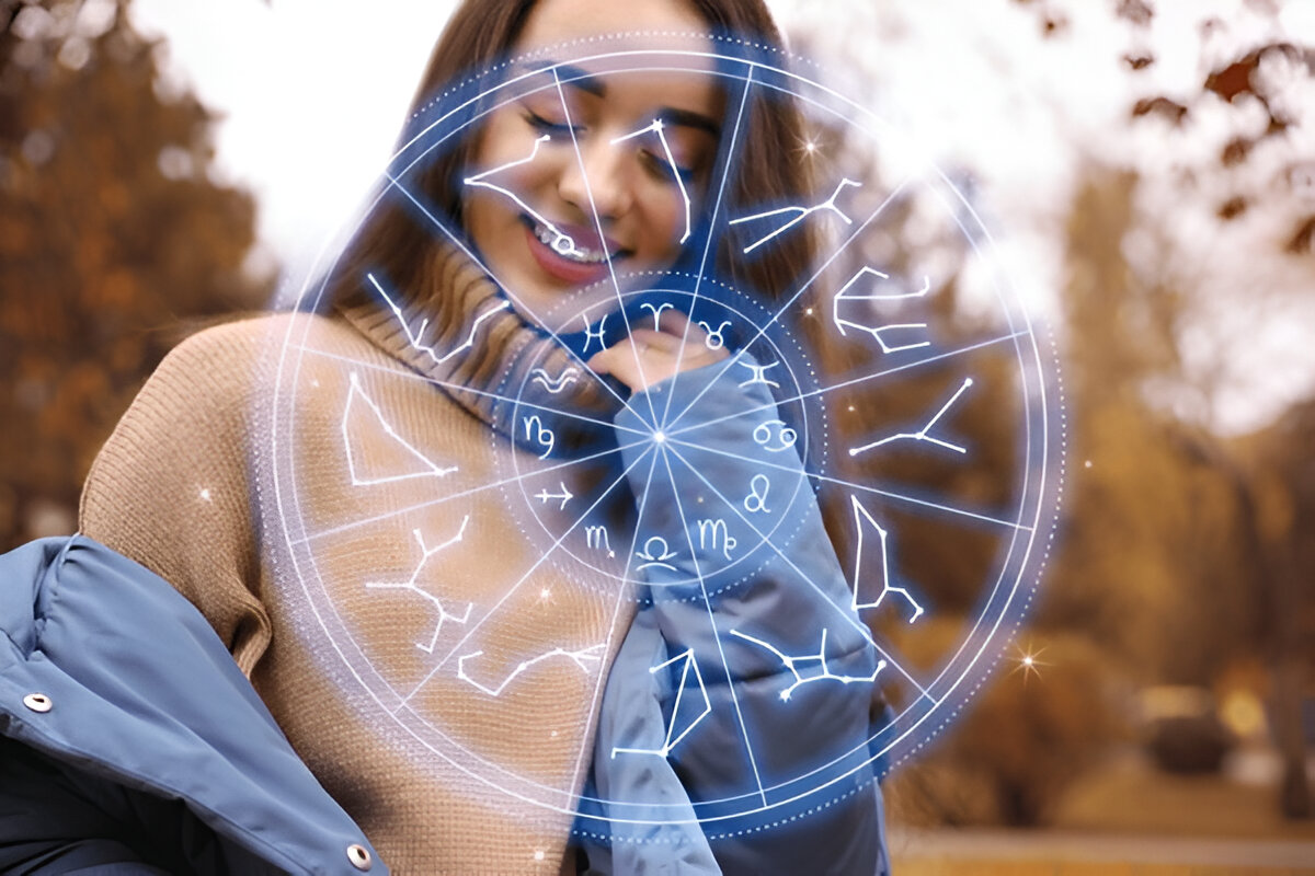 Beautiful young woman outdoors and zodiac wheel