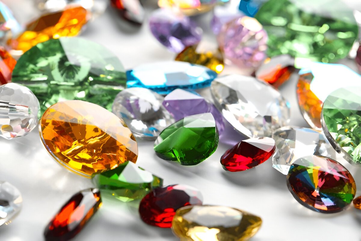 Colorful precious stones for jewellery on white background